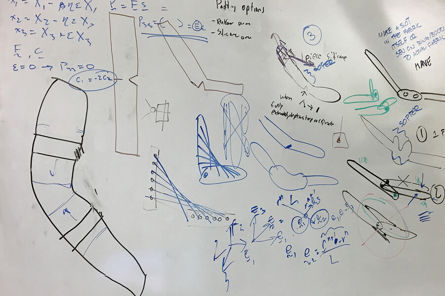 This whiteboard shows how Nauman and his team went about developing the brace.