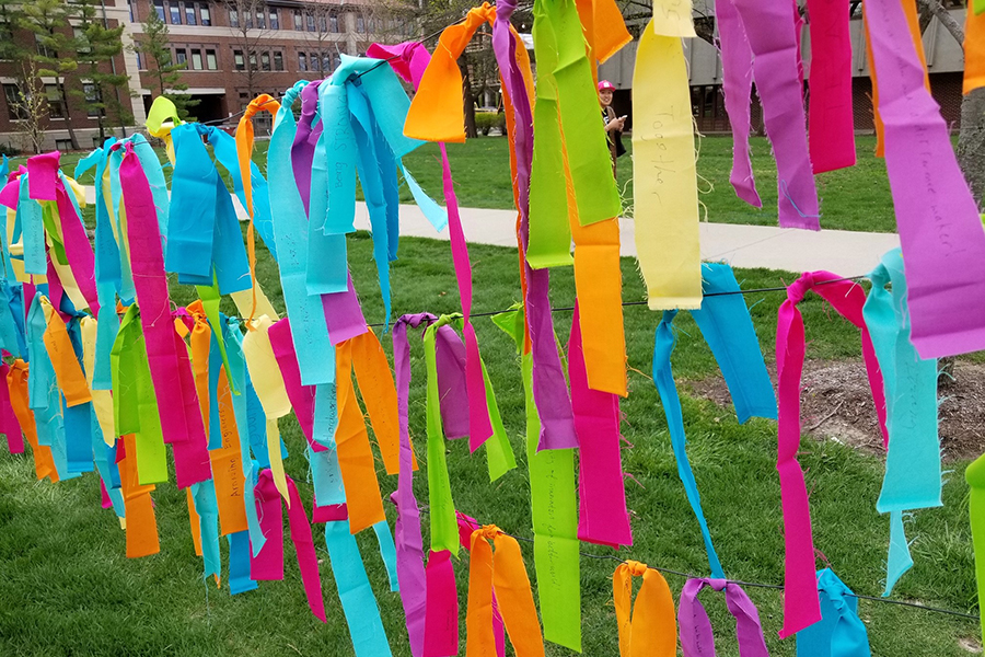 Multi-colored ribbons tied onto string on which passerby's were asked to write the answer to "A Boilermaker is..."<em> Photographer: Missy Davies </em>
