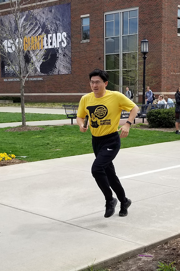 Mung Chiang, the John A. Edwardson Dean of the College of Engineering, takes his turn during the Relay Run. The dean solicited ideas from students for future events after the 2018 Day of Giving. This years run is a direct result of one of their ideas. <em> Photographer: Missy Davies </em>