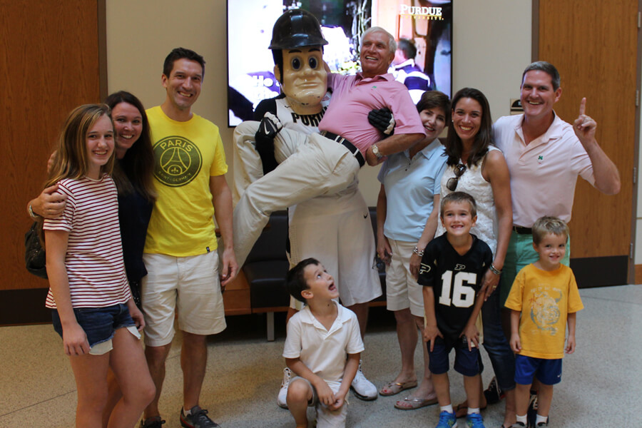 Purdue Pete supports Stan Tebbe, surrounded by his family