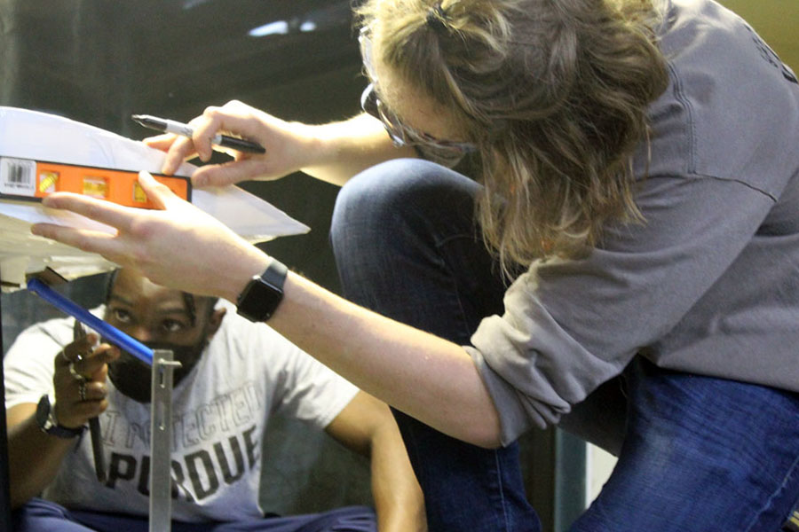 Photo of students working on wind tunnel