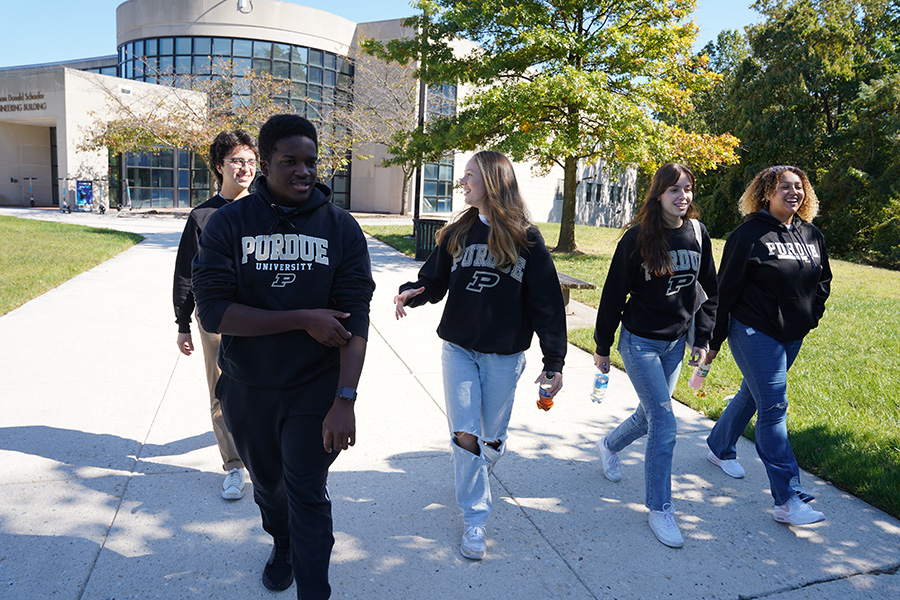 Five students walking