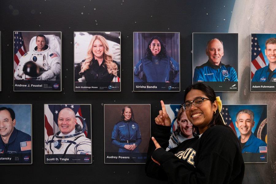 Kamal points to the portrait of astronaut Sirisha Bandla, whom she interviewed for Purdue Engineering's Engineering Heroes series. Bandla's 2021 spaceflight was a particular inspiration.