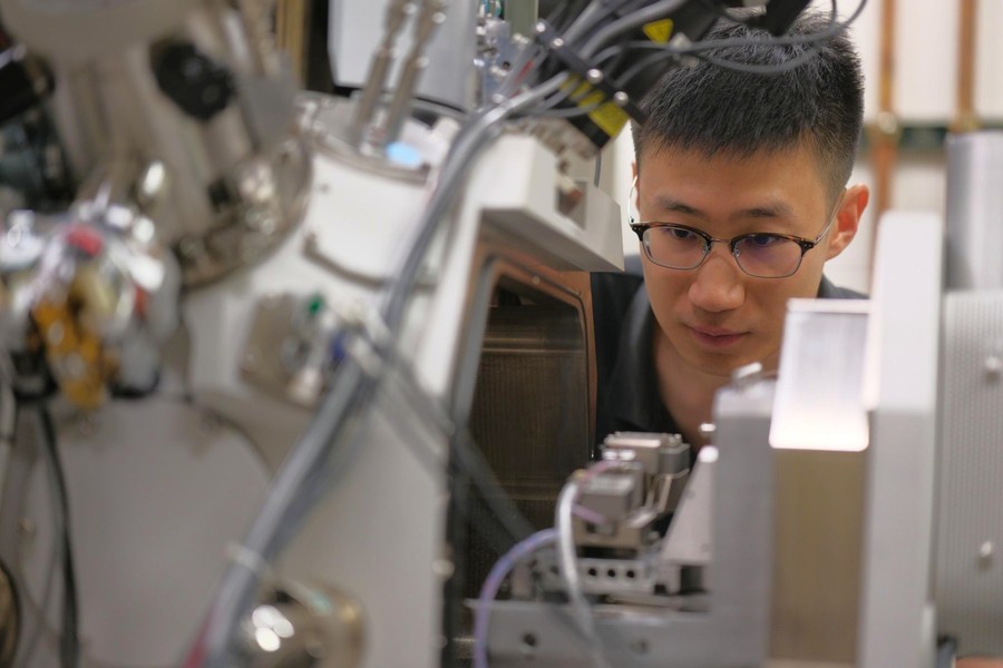Purdue postdoctoral researcher Ke Xu performs in situ nanomechanical testing on a scanning electron microscope.