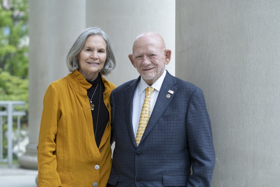 Robert H. Buckman and Joyce A. Mollerup pose together outdoors on the Purdue University campus.