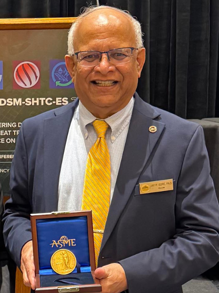 Jay Gore holds the ASME Holley Medal, one of ASME's oldest and most prestigious honors.