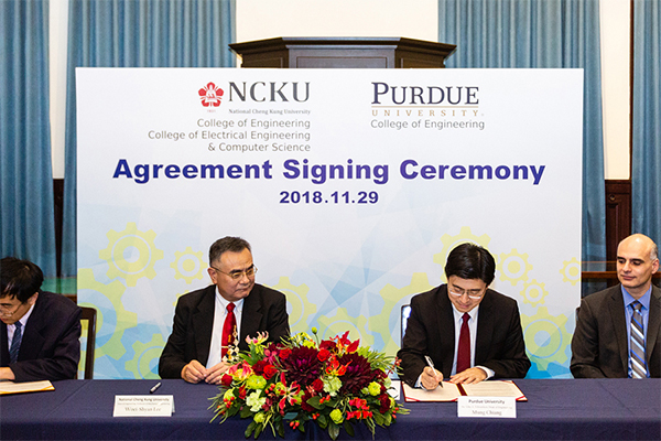 Dean Mung Chiang signing agreements