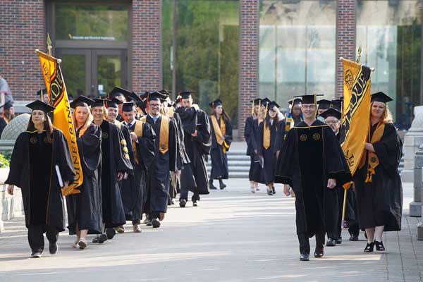 group of engineering students walking at commencement