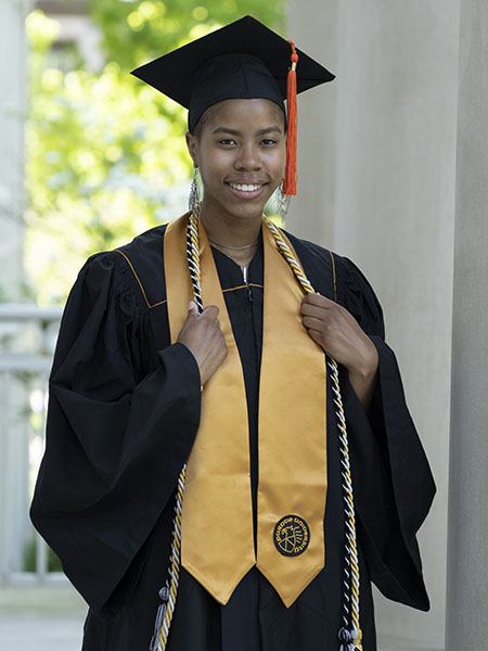 Photo of Destiny White in cap and gown