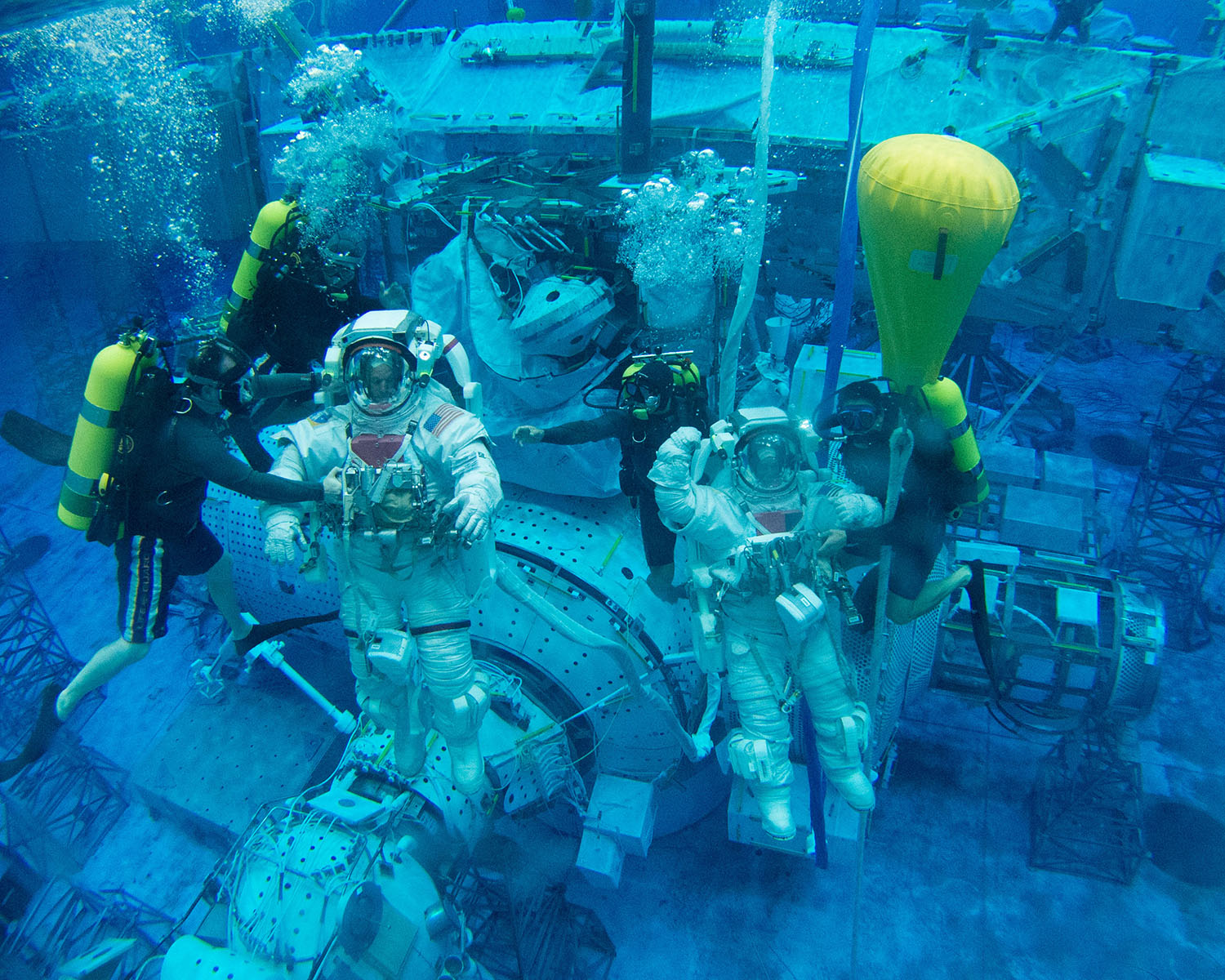 Scott Tingle (right) training with fellow astronaut Steve Swanson at NASA's Neutral Buoyancy Lab, the largest swimming pool in the world. <br>Photo Credit: NASA