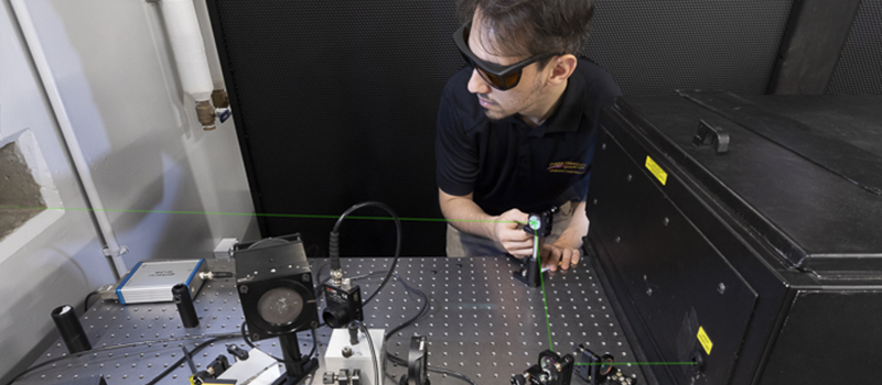 Man using a laser in a Zucrow lab