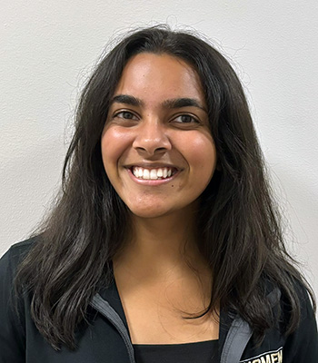 Student with dark hair, smiling