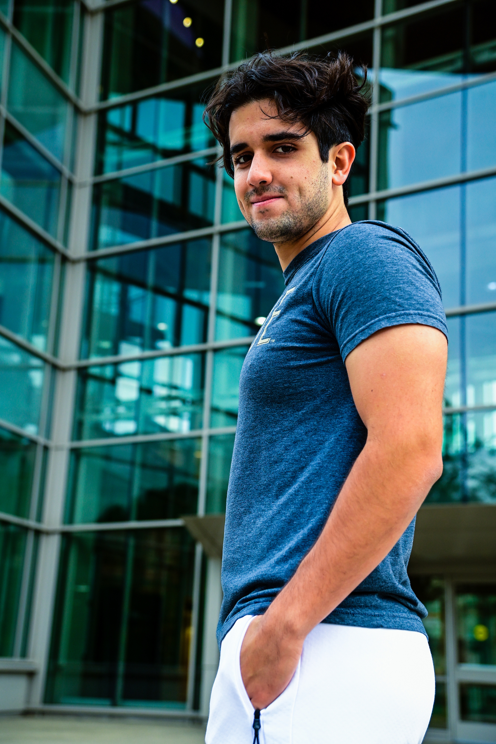 Student with dark hair and blue shirt