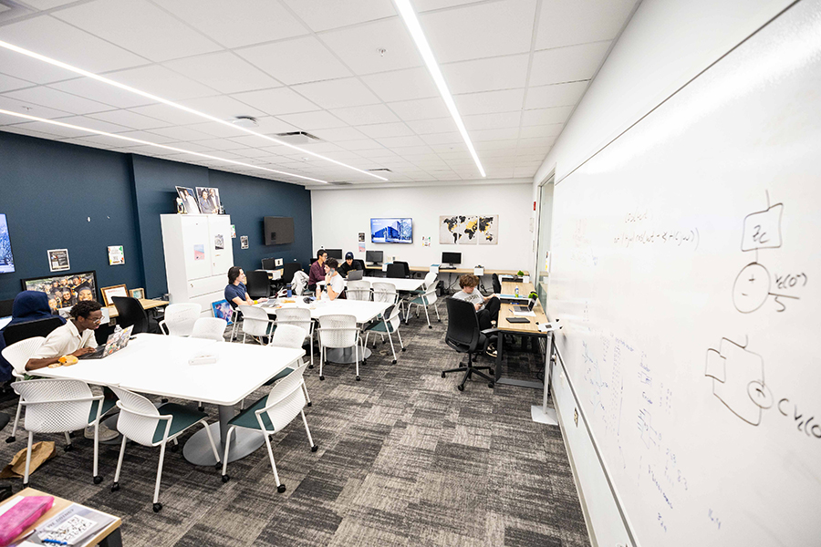 Academic Success Center, tables, computers, students working