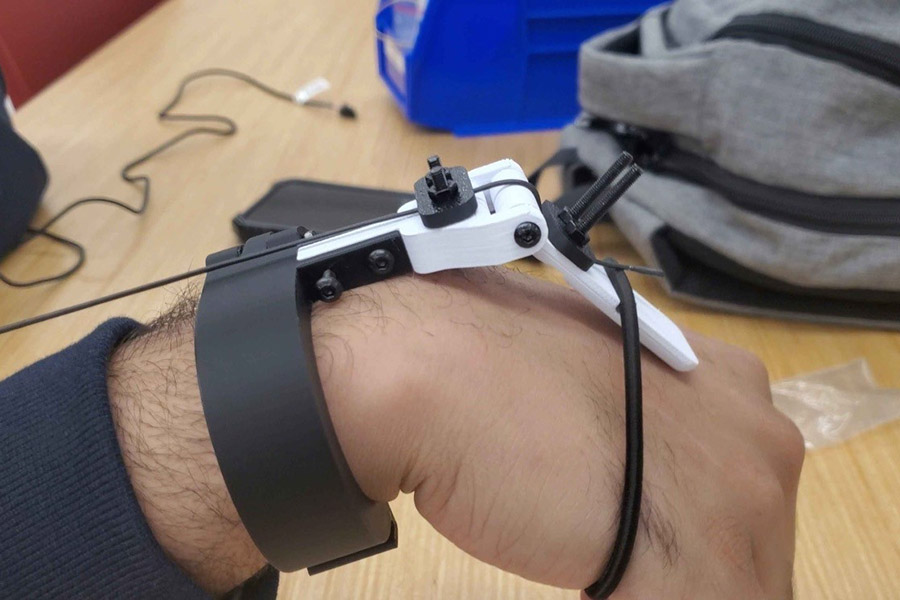 A wrist with a device attached to test for post-stroke mobility