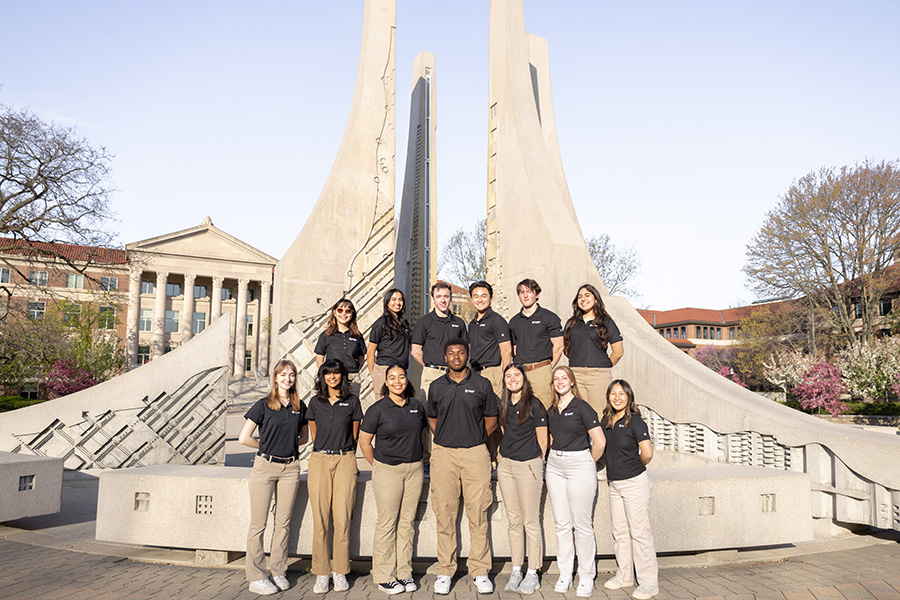 Group of students posing in front of engineering fountain 