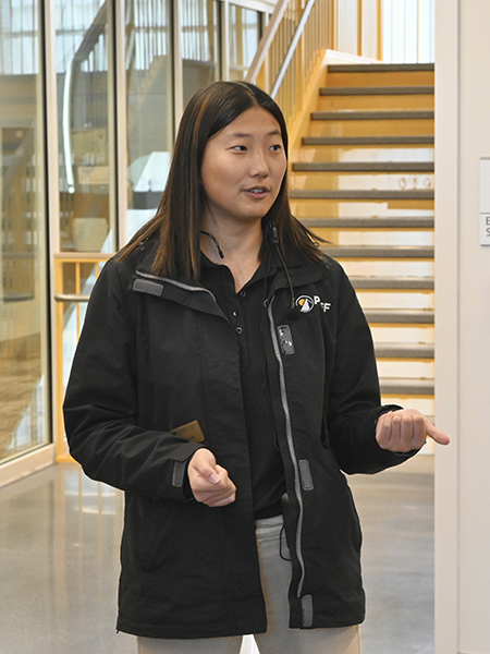 Jessica Mu speaking to students in DUDL on a tour