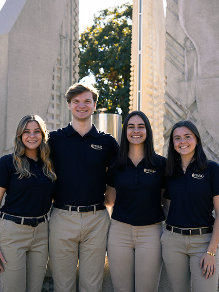 Students standing in front of engineering fountain