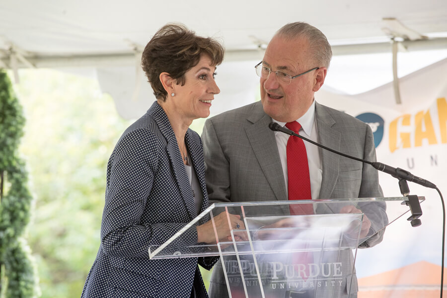 Edmund O. Schweitzer III, founder, president and chief technology officer of Schweitzer Engineering Laboratories, and his wife, Beatriz Schweitzer, speak at the groundbreaking Friday of SEL Purdue, a 100,000-square-foot facility for electric power research. The facility will support 300-plus new high-tech jobs and serve as an anchor in the university's Discovery Park District.