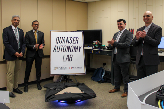 (From left to right) Arvind Raman, the John A. Edwardson Dean of the College of Engineering; Milind Kulkarni, the Michael and Katherine Birck Head and Professor in the Elmore Family School of Electrical and Computer Engineering; Paul Gilbert, CEO of Quanser; and Dimitrios Peroulis, senior vice president for partnerships and online and Reilly Professor of Electrical and Computer Engineering.