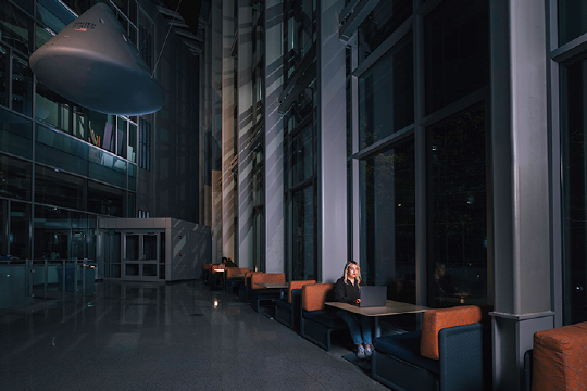 Student studying with laptop in Neil Armstrong Hall of Engineering