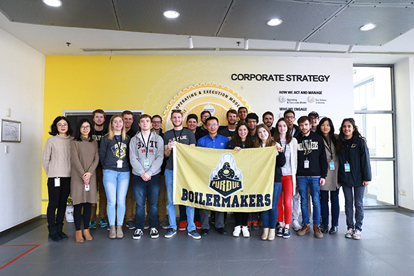 Students with the Purdue Boilermakers flag
