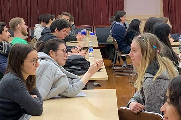 Students at tables talking