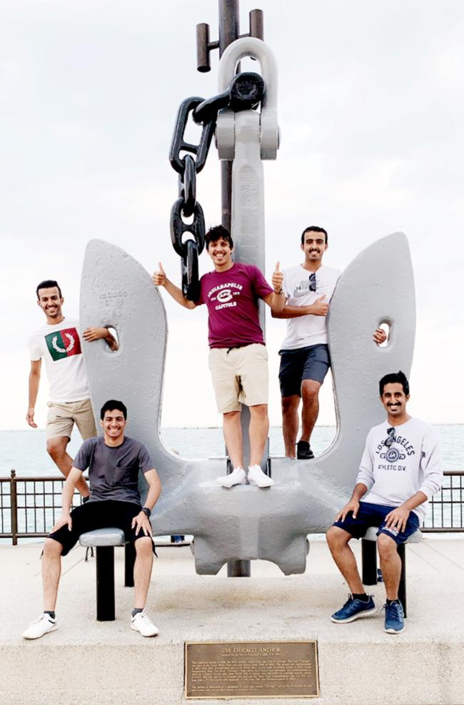 PAGE students posing on a giant anchor