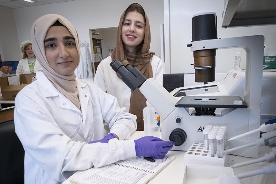 Fiza Sikandar, left, and Maria Rafiq were mentored by Agnes Doszpoly, a PhD student in biomedical engineering, and Dr. Kaisa Ejendal, a senior scientist in biomedical engineering. Together, they worked on a project studying the formation of dendritic synapses of primary hippocampal neurons in response to calcium signaling at the post-synaptic terminal via actin morphology. 