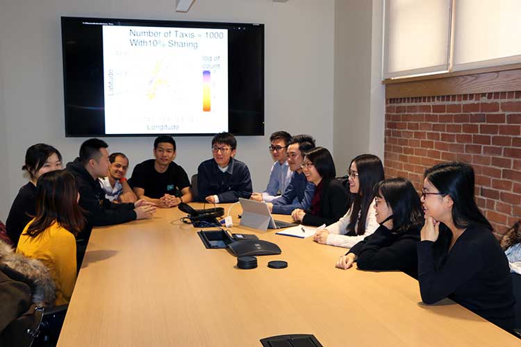 Photo of Cai group in conference room
