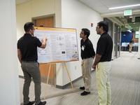 INFORMS students discuss poster