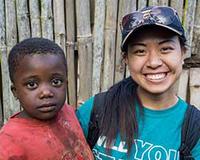 Cameroonian child with Pamela Yuan.