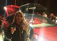Liz Held with a Tesla Model X