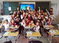 Scott Wong and Rafael Salcedo teaching English to a class of Chinese 4th graders