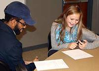 Two students discuss questions