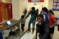 Students test the Power Pad which generates 10 watts of power for every step. 