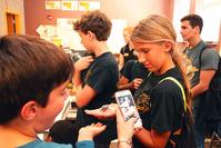 Photo of students with 3-D printed frog