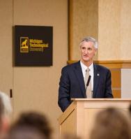 Photo of Richard J. Koubek at podium