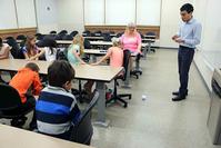 Photo of Ramses Martinez teaching elementary students