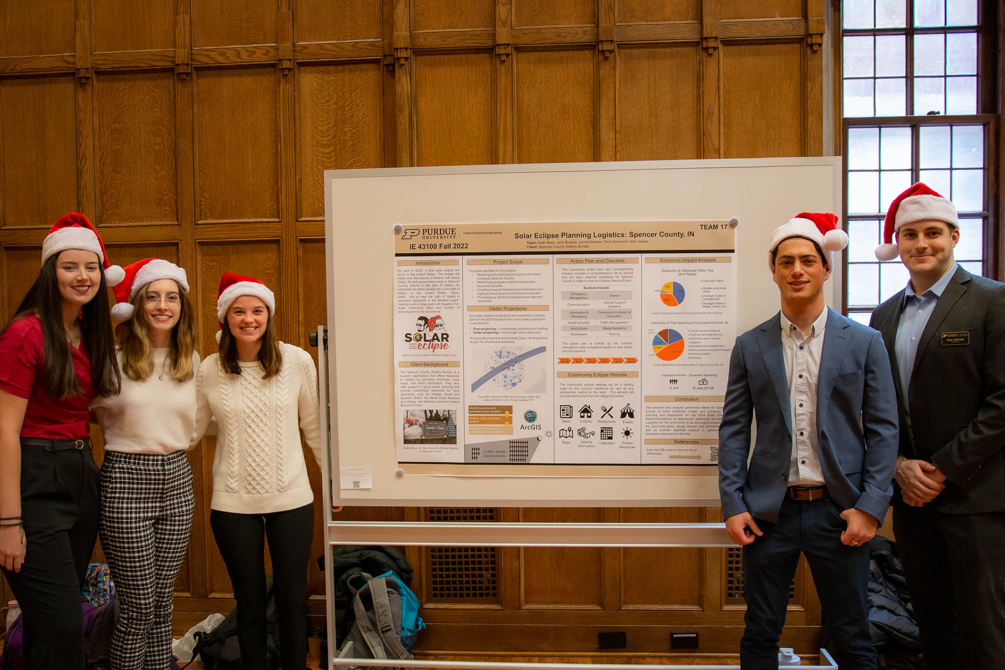 Team 17 wears festive Santa hats, as their project involved Santa Claus, Indiana.