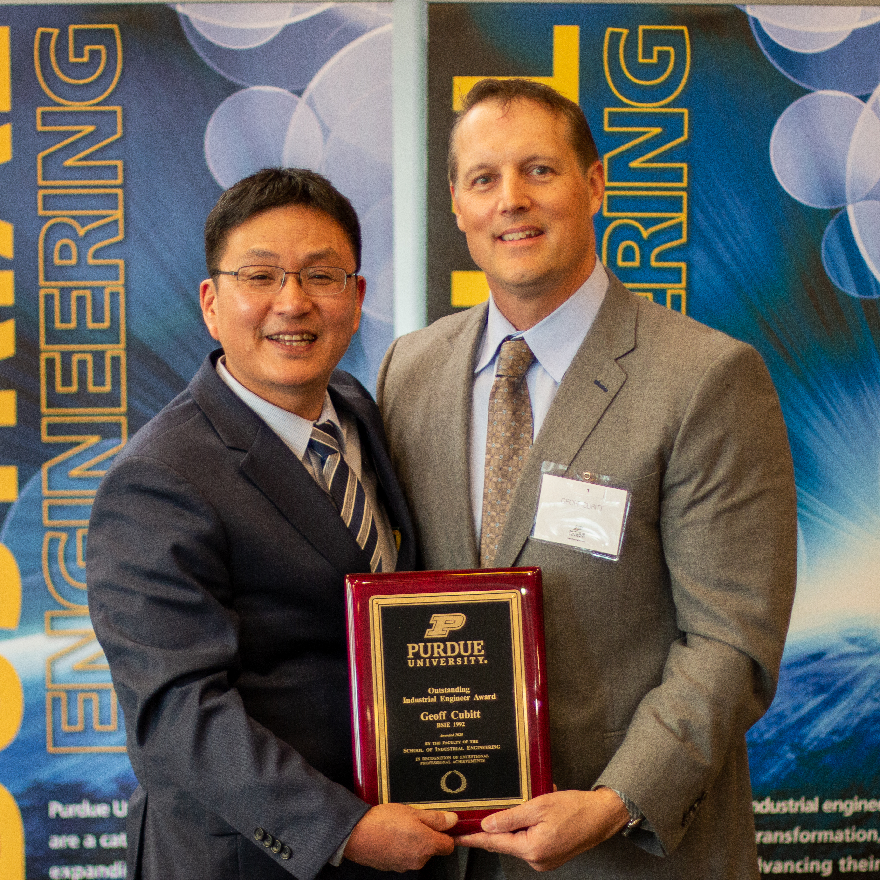 Geoff Cubit posing with Dr. Son after accepting award.