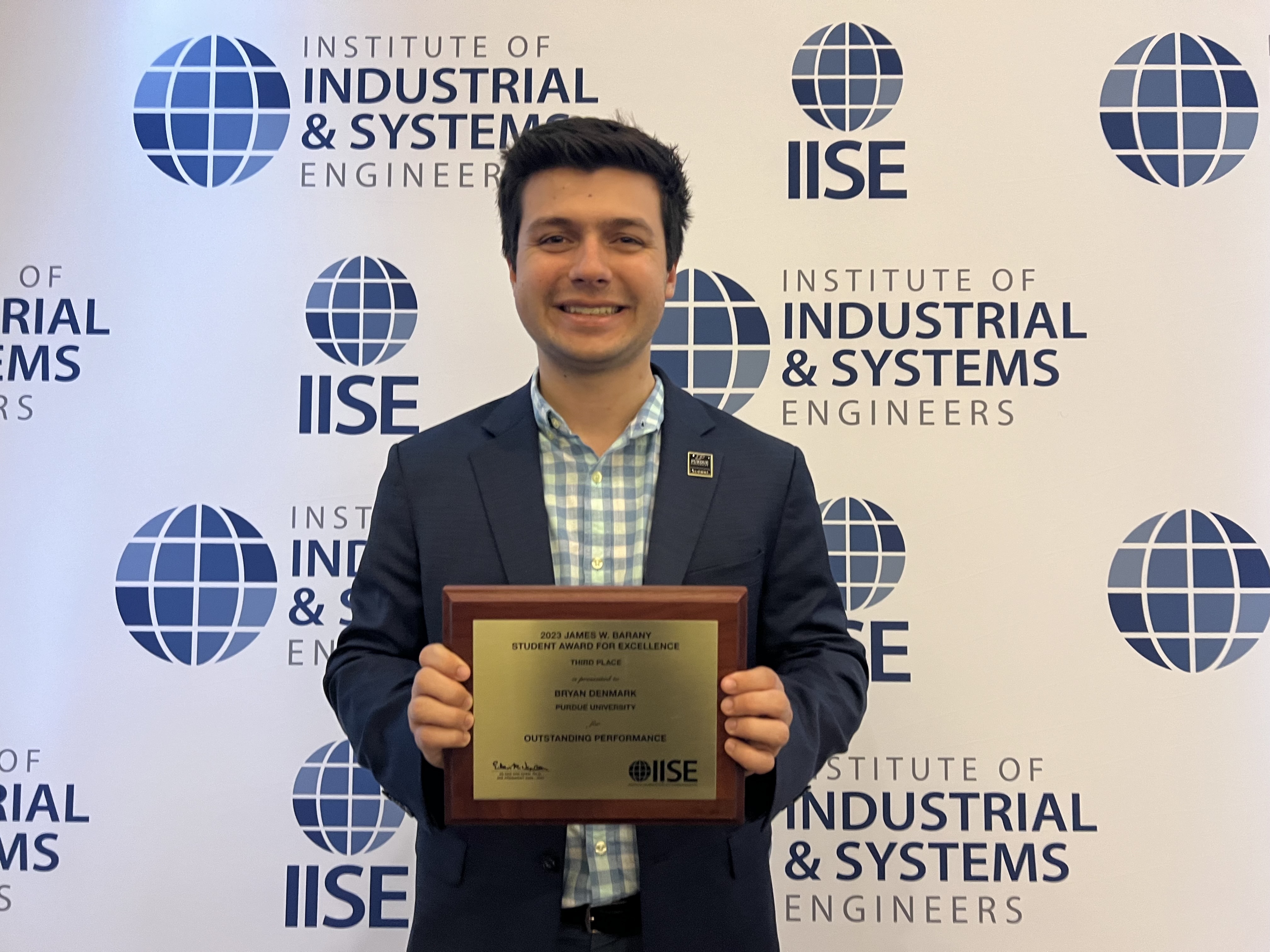 Bryan Denmark with his IISE James W. Barany Student Award for Excellence