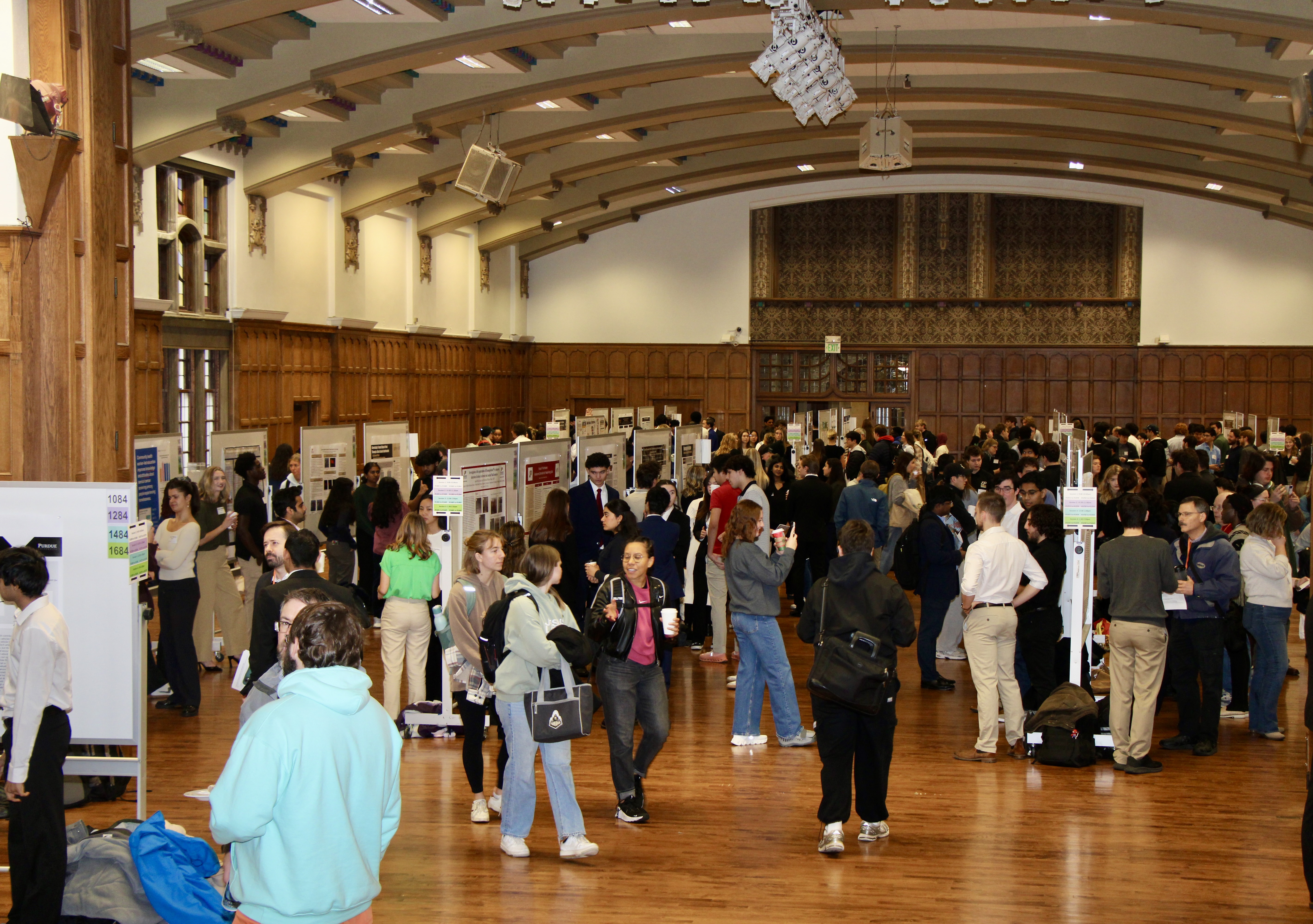 Wide angle photograph of the 2025 Undergraduate Research Expo poster session