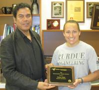 Ahmed Hassanein, Head of the School of Nuclear Engineering presenting Sarah Kish with Outstanding Undergraduate Student Plaque
