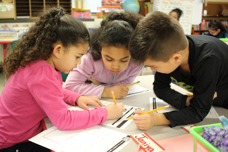 Children working together solving a problem