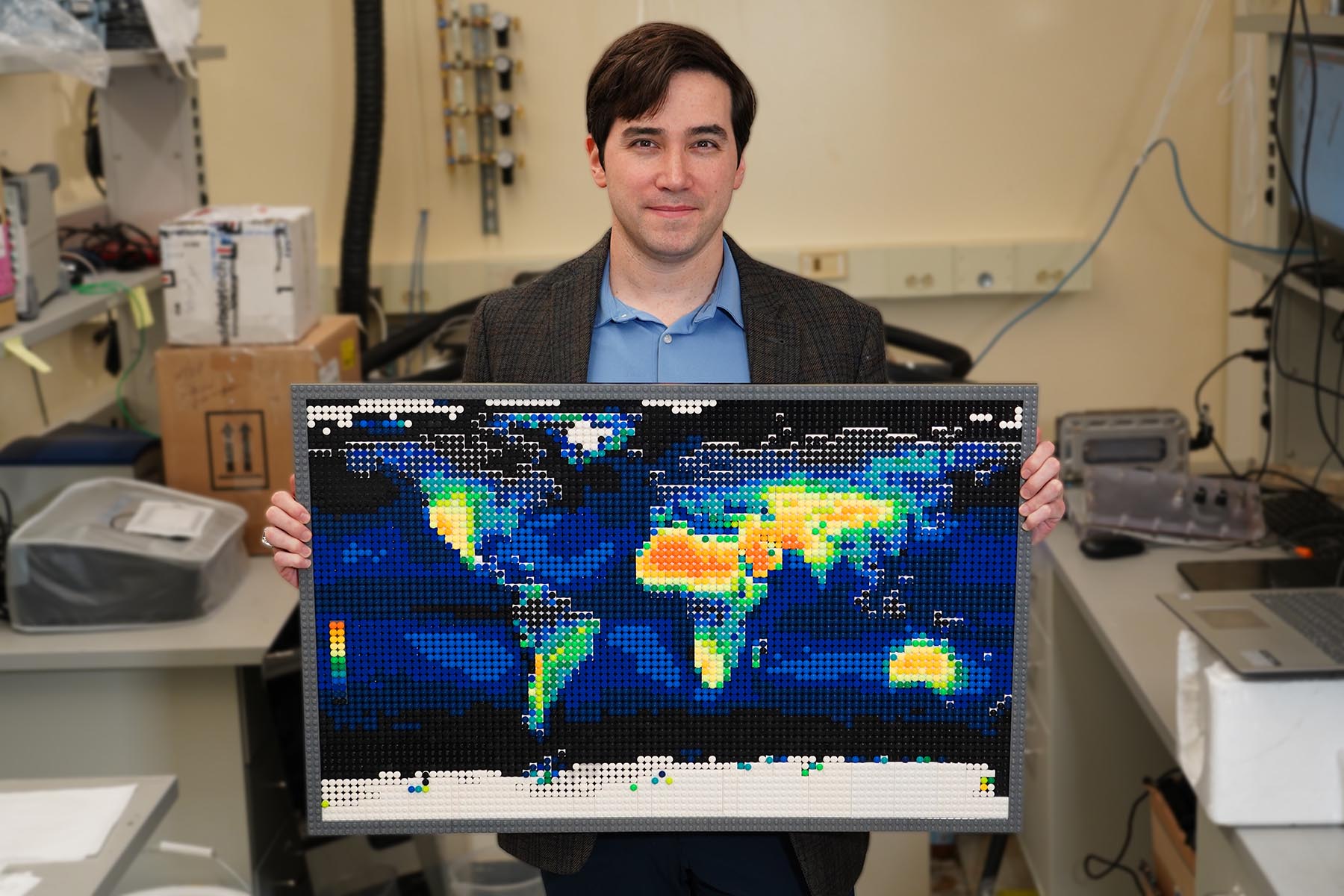 David Warsinger created this map with LEGO® bricks, showing which areas of the world require more energy to extract fresh water from the atmosphere. While the yellows and oranges of arid deserts may make these technologies seem less than ideal, Warsinger sees great opportunities in the bluer regions (Amazon basin, Congo, Southeast Asia), where water quantity is not an issue, but water quality is. (Purdue University photo/Jared Pike)