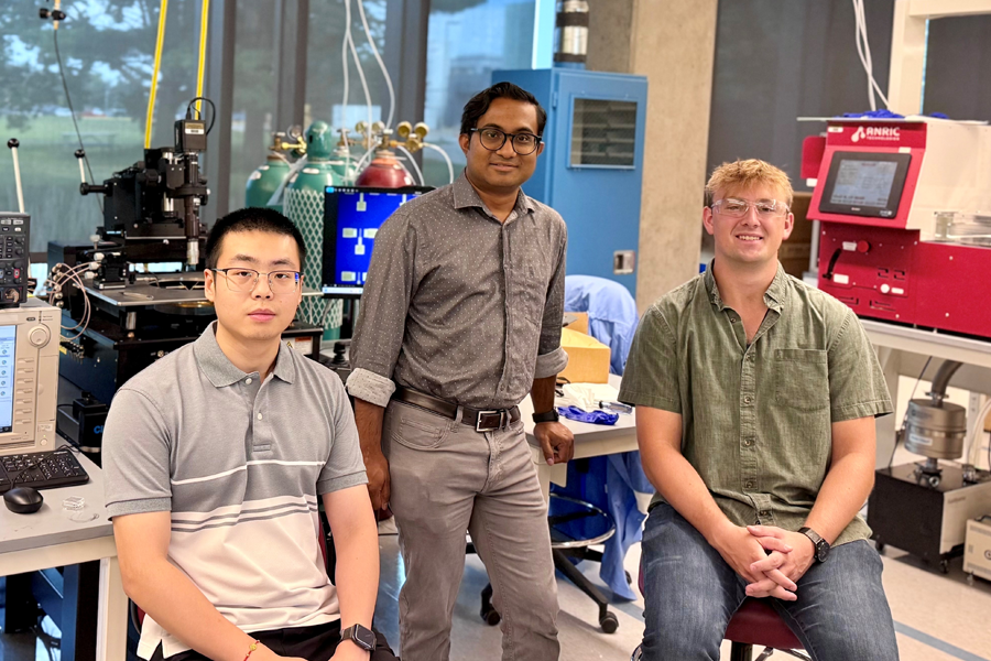 Three Purdue researchers stand together in a laboratory in the FLEX Building. From left to right are Yifan Wang, Raisul Islam, and Noah Vaillancourt.