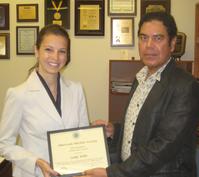 Lenka Kollar and Ahmed Hassanein holding ANS Certificate