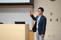 Photo of Gaojian Huang presenting at conference
