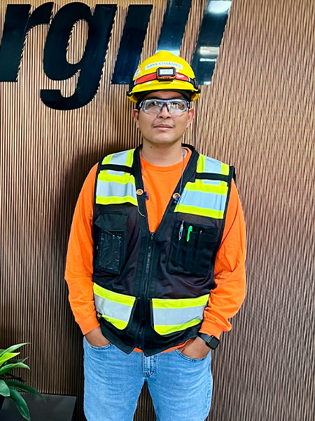 Man in high visibility vest and yellow hard hat